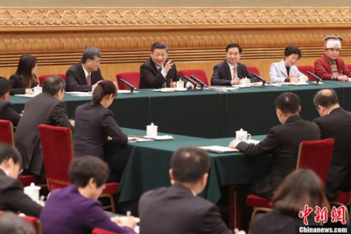 3月7日，中共中央總書記、國家主席、中央軍委主席習近平參加十三屆全國人大一次會議廣東代表團的審議。<a target='_blank' >中新社</a>記者 盛佳鵬 攝